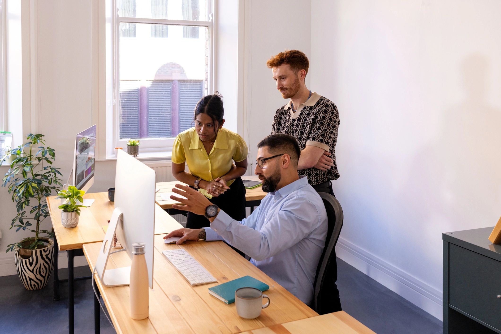Business team reviewing information on a computer